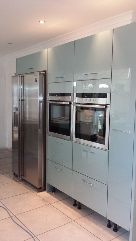 Astral #Blue Acrylic doors to give a semi gloss finish, with tall run of units incorporating double and #American #fridge #freezer. Fridge In Kitchen, Built In Fridge Freezer, Dark Grey Kitchen Cabinets, American Fridge Freezer, Floor To Ceiling Cabinets, Modern Kitchen Renovation, Dark Grey Kitchen, American Fridge, Handleless Kitchen