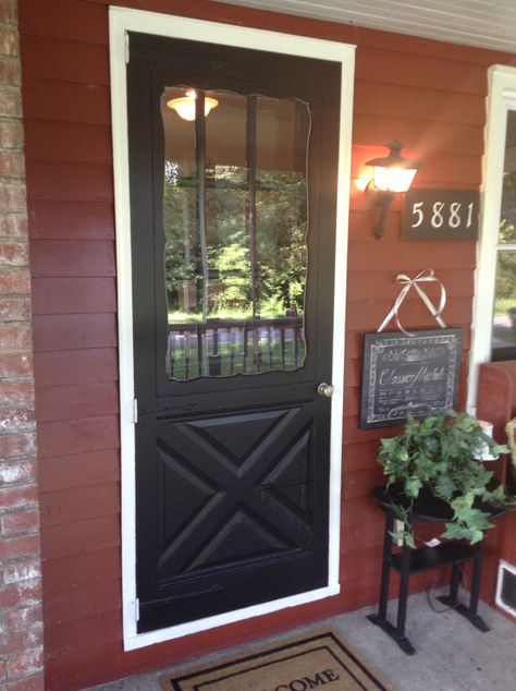 Our Red farm house. Newly painted black front door. :) Red House Black Door, Barn Remodel, Exterior Door Colors, Red Farmhouse, Ranch House Remodel, Screened Porch Designs, Black House Exterior, Black Front Doors, Cottage Exterior