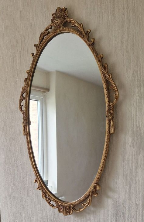 Vintage victorian style cast gold metal oval wall mirror. Ornate design with swags and scrolls border. Hanging hook set within the metal frame. Measures 66cm x 40cm x 2cm Very good overall condition. Oval Vintage Mirror, Big Oval Mirror, Edwardian Mirror, Impala Tattoo, Victorian Mirror, Bedroom Frames, Mirror Oval, Victorian Bedroom, Mirror Vintage