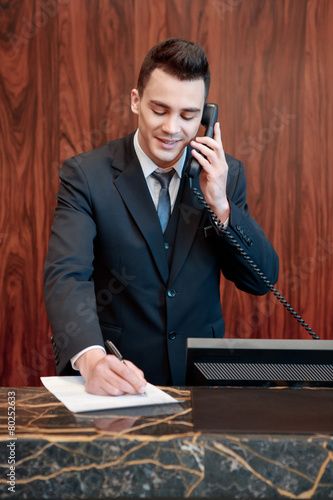 Stock Image: Receptionist answering the call استوديو الصور, Adobe Stock, Stock Images, Stock Photos