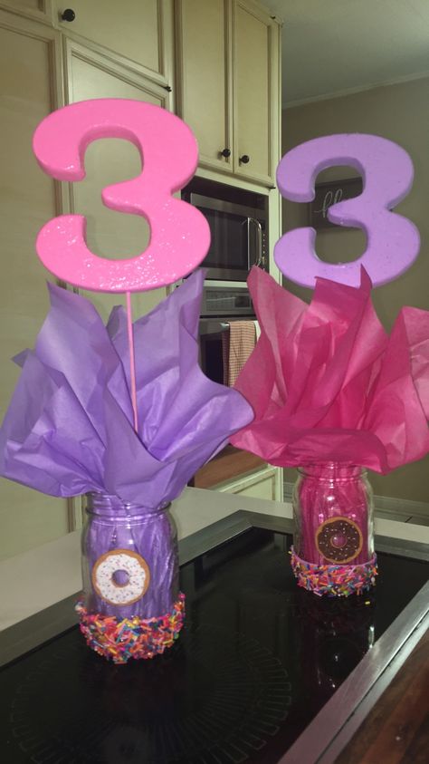 Donut Grow Up Party Decorations, Donut Grow Up 3rd Birthday Party, Donut Themed Party Centerpieces, Donut Grow Up Diy Decorations, Donut Grow Up Party Ideas, Donut Birthday Centerpieces, Donut Party Centerpieces Diy, Donut Theme Centerpieces, Diy First Birthday Centerpieces