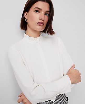 Topped with a pretty ruffle neck, our mixed media blouse is a modern romantic. Stand ruffle collar. Long sleeves with button cuffs.,Hit:26" long,Imported:Imported,Fit:Slim,Fabrication:100% Polyester,Garment Care:Machine Washable Ruffle Neck Blouse by Ann Taylor Size regular - XS Winter White Women's Split, Neck, Long, Sleeve, Blouse, Tops, 100%, Polyester, Machine, Washable Ruffle Neck Blouse, Ruffle Collar Blouse, Ruffled Collar, Blouse Tops, Ruffle Collar, Collar Blouse, Winter White, White Long Sleeve, Ann Taylor