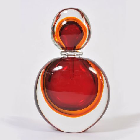 Super-sized perfume bottle and stopper in smoothly sculpted red, amber and clear Murano glass Size: 34cm high x 21cm wide x 11cm deep #murano #muranoglass #muranoperfumebottle #perfumebottle Jasmine Perfume, Pretty Perfume Bottles, Perfume Bottle Design, Perfume Bottle Art, Beautiful Perfume Bottle, Antique Perfume Bottles, Beautiful Perfume, Antique Perfume, Perfume Atomizer