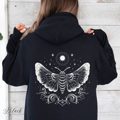 Cottagecore Celestial Moth Unisex Hooded Sweatshirt | Lunar Moth Hooded Sweatshirt | Mystical Moth Hoodie | Celestial Hoodie | Cottagecore Clothing | Dark Academia Apparel | Alternative Clothing | Aesthetic Hoodie  ✔️ Colour: Black ✔️ Design on front only, back only, or both sides ✔️ Soft, warm and cozy heavy blend unisex hoodie  ✔️ Classic Fit ✔️ Fiber composition: 50% Cotton, 50% Polyester ✔️ Medium-heavy fabric (8.0 oz/yd² (271 g/m   ✔️ Spacious kangaroo pouch pocket  ✔️ Adjustable hood with Moth Hoodie, Goblincore Clothes, Moon Hoodie, Alt Clothes, Cowgirl Aesthetic, Luna Moth, Kangaroo Pouch, Supply Chain, Zip Up Hoodie