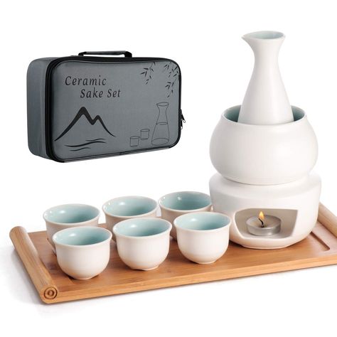 PRICES MAY VARY. This Ceramic Sake Set comes with 1 sake bottle, 1 warming mug, 1 bamboo tray for serving the included 6 sake cups, 1 stovetop for warmer (Candle NOT included). All are packaged with a protective box for easy and portable carrying. Also great choice for sake lovers. Great Traditional Porcelain Pottery Hot Saki Drink Set with Superior Quality and Elegant Design: Made of Thermal Shock Resistant Ceramic, stovetop safe. Extreme Hot and Cold Tolerance. Special Design Comes with potter Beverage Server, Bamboo In Pots, Carafe Set, Sake Bottle, Bamboo Tray, Sake Set, Japanese Sake, Drink Bottle, Drink Dispenser