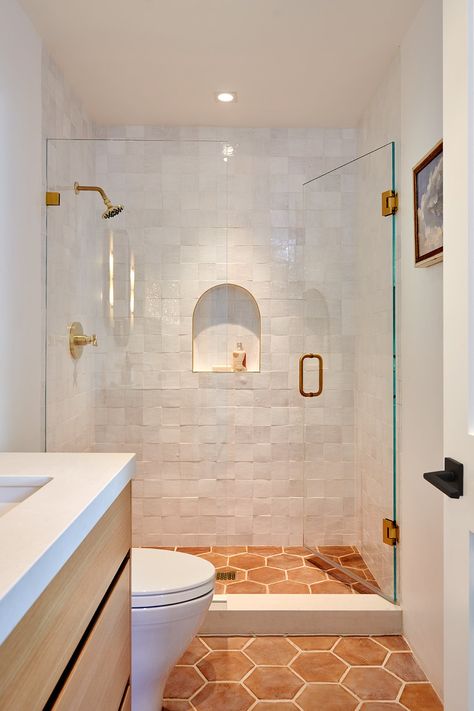 Pony Wall In Bathroom Master Bath, Bathroom Design Small Bathtub, Bedrosians Tile Shower, Spanish Walk In Shower Ideas, Small Herringbone Shower Tile, Small Shower Renovation Ideas, Terracotta Tile Shower Ideas, Long Narrow Guest Bathroom, Bathroom Vanity Architectural Digest