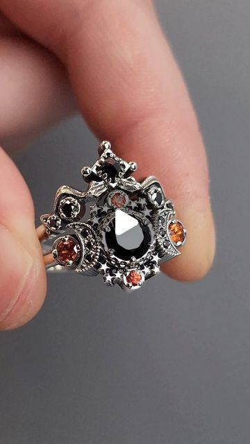 2,667 likes, 43 comments - swankmetalsmithing on January 28, 2024: "Black Cosmos Triple Moon Engagement Ring with Orange Sapphires and Snake Witch Chevron Wedding Ba..." Snake Witch, Moon Engagement Ring, Chevron Wedding Band, Chevron Wedding, Triple Moon, Orange Sapphire, Cosmos, Wedding Bands, Chelsea