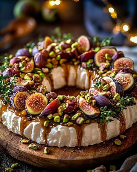 🧀🌿✨ Fig, Goat Cheese & Pistachio Wreath   Ingredients:   For the Wreath Base:   - 8 ounces goat cheese, softened   - 4 ounces cream cheese, softened   - 1 tablespoon honey   - 1 teaspoon fresh thyme leaves    For the Toppings:   - 5–6 fresh figs, quartered   - ⅓ cup pistachios, roughly chopped   - 2 tablespoons honey   - 1 tablespoon balsamic glaze   - Fresh thyme sprigs (optional, for garnish)    For Serving:   - Crackers, baguette slices, or fresh vegetables    Directions:   1. In a mixing bowl, combine the softened goat cheese, cream cheese, honey, and fresh thyme. Mix until smooth and well combined.   2. Shape the cheese mixture into a wreath on a serving plate, leaving a hole in the center to form the wreath shape. Chill for 15–20 minutes to allow it to firm up.   3. Once the wreath Goat Cheese Pistachio, Fig Goat Cheese, Buffet Party, Jamie Oliver Recipes, Charcuterie Inspiration, Wreath Base, Charcuterie Recipes, Christmas Food Dinner, Fresh Figs