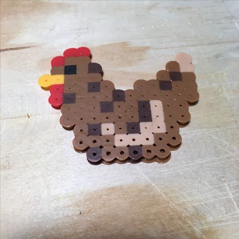 Perler melting beads chicken. Pixel art, crafts, small square board, farm animals Peeler Bead Chicken, Chicken Hama Beads, Peeler Bead Animals, Chicken Perler Beads, Chicken Pixel Art, Cozy Hobbies, Melted Beads, Ironing Beads, Giraffe Crafts