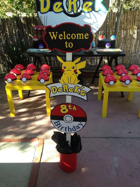 Derek's Pokemon Go Birthday Party  | CatchMyParty.com Pokemon Cake Table Ideas, Pokemon Birthday Party Outside, Pokemon Go Party, Pokemon Go Birthday Party, Pokemon Birthday Centerpieces, Pokemon 10th Birthday Party, Pokemon Birthday Ideas Diy, Pokemon Party Ideas Decoration, Pikachu Birthday Party Decorations