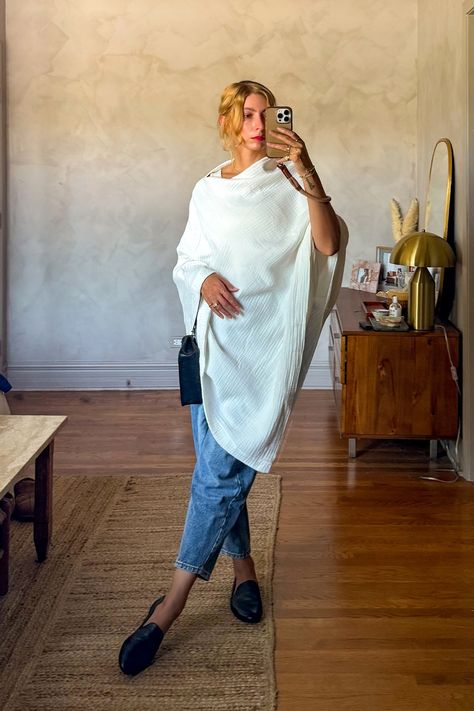 styled a white cotton poncho for a boat outing with a pair of barrel jeans and black loafers • how to style a poncho • how to style a cape • cozy chic outfit ideas • how to style barrel jeans • black loafers outfit • quiet luxury aesthetic • coastal aesthetic • Style A Poncho, How To Style A Poncho, Cozy Chic Outfit, Quiet Luxury Aesthetic, Black Loafers Outfit, Poncho Outfit, Cape Outfit, Aesthetic Coastal, Barrel Jeans