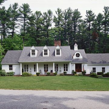 Adding dormers helped give this ranch a new look outside and extra room inside. Their classic gable fronts repeat the roof pitch of the original structure. New windows, siding, and porch columns complement the dormers' classic simplicity. Dormers Added To Ranch, Gabled Windows, Greek Pillars, Tri Level House, Ranch Home Remodel, Ranch Renovation, 80s Country, Home Renovation Costs, Roof Pitch