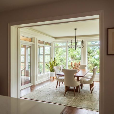 What a difference this addition made to this house, both inside and out! We added about 360 square feet with a new dining room and sun room. . Additions can be tricky, and this one was especially so, with a combination of indoor and semi-outdoor space. With special attention to detail, we designed this addition to be seamlessly integrated with the existing home so that it looks like it's always been there. ______________________________________________ #homeaddition #interior #interiorst... Three Season Porch Dining Room, Screened In Porch Dining Room, Dining Room With Big Windows, Dining Room In Sunroom, Dining Room Sunroom Combo, Dining Room Bump Out Addition, Sunroom Dining Room Off Kitchen, Dining Room Addition Off Kitchen, Bump Out Dining Room