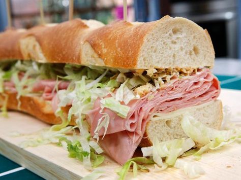 Get Jeff Mauro's Giant Mortadella Sub Recipe from Food Network Mortadella Sandwich, Submarine Sandwich, Jeff Mauro, The Kitchen Food Network, Sub Sandwich, French Fried Onions, Sub Sandwiches, Simple Sandwiches, Burgers Sandwiches