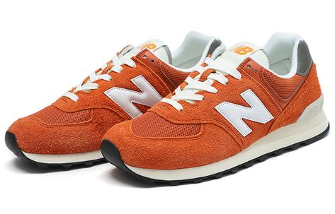 The New Balance 574 'Orange Burst' is a classic silhouette that brings back the retro look with a modern twist. Featuring an Encap midsole for superior cushioning and comfort, the sneaker is perfect for everyday wear. The orange and white colorway adds a subtle yet stylish touch to any outfit. The 574 series is inspired by the classic New Balance look, making it the perfect choice for those who appreciate classic style. With the rubber sole, the sneaker is perfect for any activity, from running New Balance Classics, Shoes For School, Lifestyle Shoes, Funky Shoes, Marathon Running Shoes, New Balance 574, Fall Clothes, New Balance Sneakers, Balance Shoes