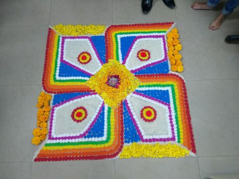 Swastik Rangoli with color and using rice and flower petals Swastik Rangoli Designs, Swastik Rangoli, Flower Rangoli Designs, Rangoli Designs Photos, Easy Rangoli Designs Diwali, Guru Quotes, Rangoli Designs Diwali, Rangoli Designs Images, Flower Rangoli