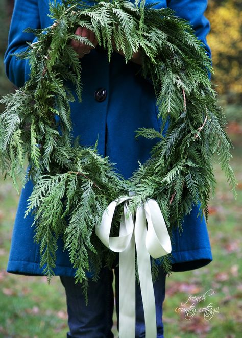 You might have noticed that I pretty much love using fresh greens  for Christmas decorating in my home For everything from dressing the mantels  to making my own simple fresh cedar wreaths. You know those  unstructured and oh so pretty wreaths that look like you just walked out into your yard  filled a basket with… French Country Cottage Christmas, Cedar Branch, Branch Wreath, Cottage Diy, Cedar Wreath, Fresh Garlands, French Country Christmas, Christmas Tree Lots, Easy Christmas Wreaths