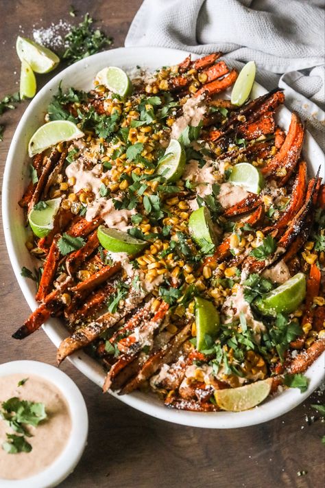 Mexican Street Corn Sweet Potato Fries are inspired by one of my favorite foods - Elotes! These Mexican Street Corn Sweet Potato Fries have a delicious crema with lime juice, topped with cotija cheese, and cilantro. It's a recipe that you will LOVE! Mexican Sweet Corn, Mexican Sweet Potatoes, Elote Recipe, Cinco De Mayo Recipes, Mexican Street Corn Salad, Mexican Street Corn, Superbowl Party Food, Street Corn, Potato Fries