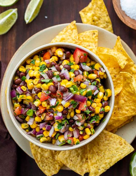 Black Bean and Corn Salsa is a refreshing dip made with black beans, corn, tomato, onions, jalapeno, cilantro, lime juice, and garlic. Appetizer, Salsa, Black Bean Salsa, Cowboy Salsa, Fresh Salsa, Easy Salsa, Game Day Food, Super Bowl Recipes, recipes, i am homesteader, iamhomesteader Tomato Black Bean And Corn Salsa, Black Bean And Corn Dip, Avocado Corn Salsa, Black Bean And Corn Salsa, Corn Bean Salsa, Savory Dips, Black Bean Corn Salsa, Black Bean And Corn, Homemade Tortilla