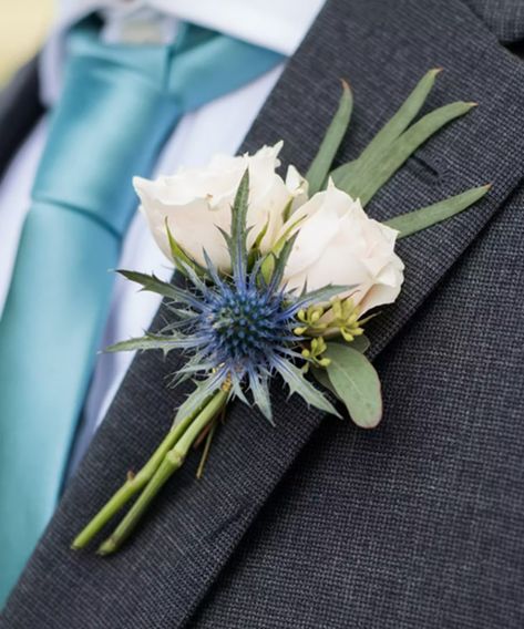 Handsome Boutonniere | Alexandria (VA) Corsage & Boutonniere Delivery | Conklyn's Florist Modern Boutonniere, Thistle Boutonniere, Mens Boutonniere, White Spray Roses, Blue Thistle, Sea Holly, Corsage And Boutonniere, Prom Flowers, Groom Boutonniere