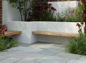 Contemporary hardwood benches built into a white rendered, walled seating/patio area Stonemarket: Garden range: Natural Stone: Trustone Fellstyle Concrete Garden Bench, Garden Seating Area, Garden Paving, Walled Garden, Concrete Garden, Have Inspiration, City Garden, Garden Seating, Courtyard Garden