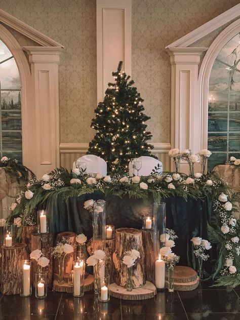 Christmas Wedding Mr And Mrs Table, Christmas Wedding Couple Table, White Rose And Pine Centerpiece, Wedding Sweetheart Table Ideas Christmas, Winter Bride And Groom Table, White And Green Winter Wedding Centerpieces, Winter Wonderland Sweetheart Table, Evergreen Wedding Theme, Winter Wedding Table Garland