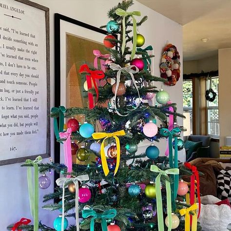 Ali Edwards on Instagram: "Colorful, festive + fun ⭐️. I have so loved switching things up with our tree this year. Most years our tree is a combination of ornaments from my childhood (and others collected throughout my life) and ornaments the kids have collected over the years along with white twinkle lights. I have always loved the nostalgia of that set up + revisiting the stories that go along with so many of those ornaments and I’m sure I’ll do that again in the future. This year I decided to do something completely different (initially inspired by Anna’s request for colorful lights + supported by my 2023 #onelittleword “joy”) and went with a couple boxes of colorful ball ornaments, colored lights, and velvet ribbon tied in bows. I’m so glad Anna pressed + planted that seed to mix thin White Christmas Tree With Colorful Decor, Colorful Christmas Tree With Ribbon, Colorful Ornaments Christmas Tree, Colored Lights Christmas Tree Decorating, Christmas Tree With Velvet Ribbon, Ribbon Trees Christmas, Colored Lights Tree, Bright Colored Christmas Tree, Velvet Bows On Christmas Tree