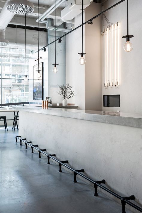 Richard Lindvall renovates former factory for Usine restaurant Industrial Restaurant Interior, Scandinavian Lights, Bar Restaurant Design, Monochromatic Interior, Concrete Bar, Architecture Restaurant, Interior Design Examples, Woods Restaurant, Industrial Restaurant