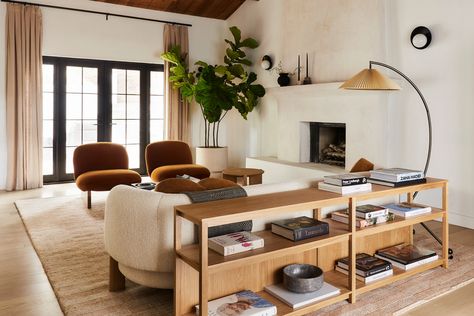 Bobby Berk's LA Headquarters Marvin Doors, Black Railing, Faux Trees, Room Focal Point, Easy House Plants, Bobby Berk, Grove Street, Entry Stairs, Low Bookcase