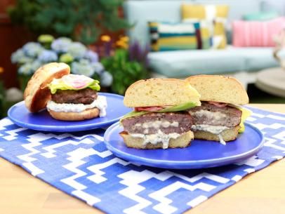 Cheese-Stuffed Lamb Burgers Recipe | Geoffrey Zakarian | Food Network Lamb Burger Recipes, Stuffed Lamb, Lamb Burger, The Kitchen Food Network, Geoffrey Zakarian, Onion Rolls, Lamb Burgers, Olive Tapenade, Ground Lamb