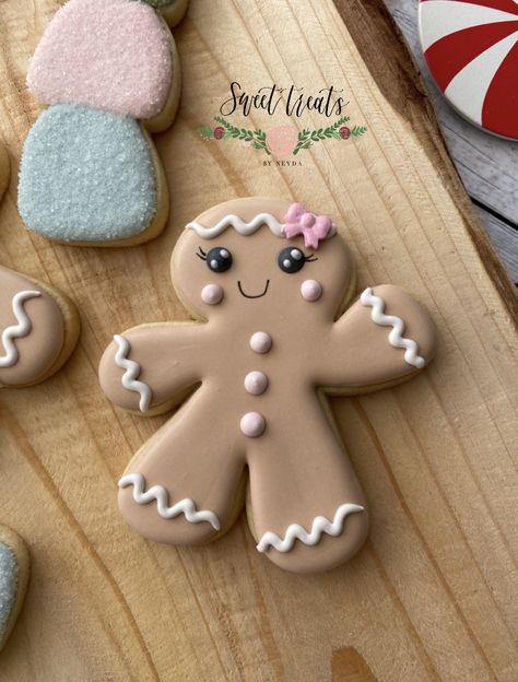 Gingerbread girl cookie Gingerbread Man Cookies Decorated Ideas, Pink Gingerbread Cookies, Gingerbread Cookies Decorated Ideas, Girl Gingerbread Cookies, Gingerbread Cookie Icing, Icing For Gingerbread Cookies, Gingerbread Girl Cookie, Gingerbread Boy And Girl, Painted Sugar Cookies