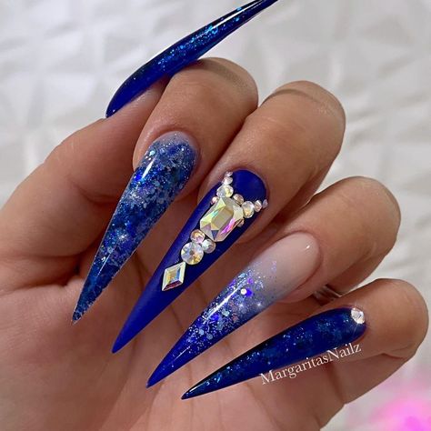 Royal blue ombré stiletto nails ombré and bling design by MargaritasNailz  #glitternails#whitenails#coffinnails#ombrenails#MargaritasNailz#whiteombre#nailfashion#nailswag#nailpro#nailedit#rosegold#royalblue#nailsofinstagram#weddingnails#nailaddict#valentinomargaritasnailz#instagramnails#nailporn#winternails#fallnails#nailtrends#modernsalon#unicornnails#naildesigns#bluenails#pinkandwhite#blingnails#nailart#pearlnails#nudenails Royal Blue Nails Designs, Blue Stiletto Nails, Blue And Silver Nails, Acrylic Nails Stiletto, Blue Stilettos, Royal Blue Nails, Pointy Nails, Blue Acrylic Nails, Ombre Acrylic Nails