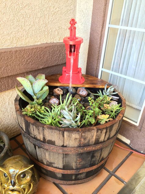 Whiskey barrel planter and fountain. Barrel Garden Ideas, Barrel Planter Ideas, Whiskey Barrel Flowers, Barrel Garden Planters, Wine Barrel Garden, Fountain Planter, Barrel Fountain, Whiskey Barrel Planter, Barrel Flowers