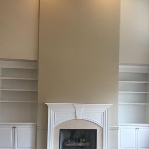 Accessible beige on back walls with universal khaki on th fireplace wall. Combination looks amazing. Sherwin Williams Universal Khaki, Shoji White Walls With Accessible Beige Trim, Sw Kilim Beige, Sherwin Williams Pavilion Beige, Accessible Beige Sherwin Williams Lightened 50%, Repose Gray Paint, Concrete Paint Colors, Pretty Living Room, Beige Paint Colors