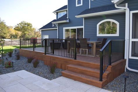 Deck Stain Ideas For Blue House, Back Deck Ranch Style Home, Back Deck Patio Furniture Ideas, Decks On Ranch Style Homes, Tan House Deck Color Ideas, Blue House With Deck, Trek Deck Ideas Design, Deck Colors For Blue House, Deck And Concrete Patio Combo