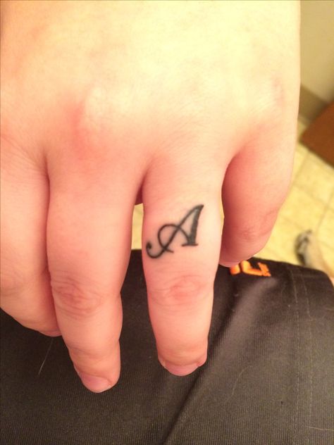 Husband's initial on ring finger 2nd tattoo on 6/1/16 Initial On Ring Finger, Ring Finger Tattoo Couple Initials, Finger Letter Tattoos, Husband Name Tattoos, Finger Image, Name Tattoo On Hand, Ring Finger Tattoo, Tattoo On Finger, Husband Tattoo