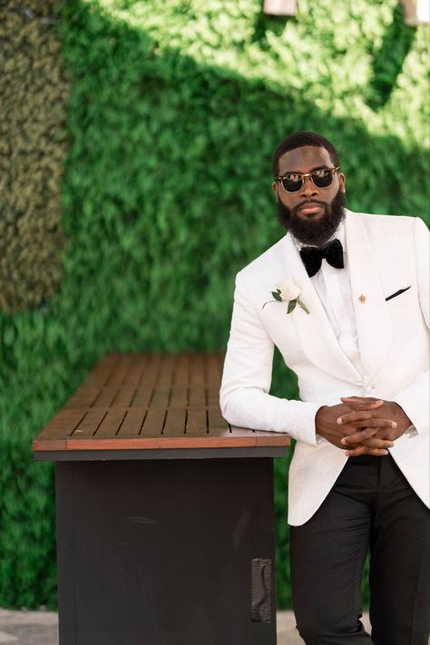 Black Groom Tuxedo Wedding, Black Man Suit Wedding, Black Man Wedding Outfit, Wedding Suits Men Black Tuxedos Groom Attire White Ties, Mens Wedding Suits Black Groom Attire, Tuxedo Photoshoot Men, White Groom Suit Black Groomsmen, White And Black Wedding Suit, Mens Tuxedo Wedding Black Groom Suits