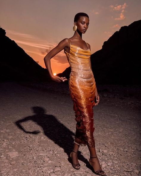 Hamda Al Fahim on Instagram: ""Sunset" -  A mesmerizing piece that captures the ethereal beauty of the sun as it dips below the horizon. A true masterpiece of haute couture.  The dress is adorned with intricate beadwork resembling the different shades  of the sunset, transitioning seamlessly into layers of beeded panels of  warm golden hues delicately to mimic the gradience of the sun in a silhouette that accentuates the figure. This  dress isn’t just a garment; it is a work of art,  a testament to the beauty &splendor of nature’s most awe-inspiring moments. #Hamdaalfahim #hautecouture" Hamda Al Fahim, Instagram Locations, Haute Couture Dresses, Ethereal Beauty, The Horizon, The Sunset, Beaded Dress, Couture Dresses, Tulle Dress