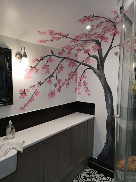 Cherry blossom mural in a small bathroom