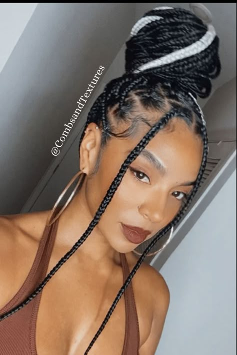 Medium large Knotless Braids styled into a top bun. Fulani Braids Ginger, Knotless Bun, Medium Large Knotless Braids, Medium Large Knotless, Knotless Braids Styled, Box Dreads, White Hairstyle, Large Knotless Braids, Braided Bun Styles