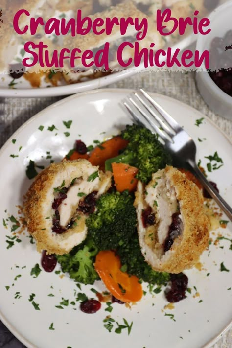 one plate of cranberry brie stuffed chicken with steamed carrots and broccoli with a platter of cranberry brie stuffed chicken in the background. Brie Stuffed Chicken, Chicken Dishes For Dinner, Stuffed Chicken Recipe, Brie Cranberry, Cranberry Brie, Cranberry Chicken, Chicken Eating, Cranberry Recipes, Winner Winner Chicken Dinner