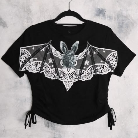 🕸️🦇bat lace tee🦇🕸️ fit: ruched sides tie fastening, crop // material: 100% cotton 150GSM // sizing 2XS - XL // dropping 4th October // 6pm UK time Diy Lace Up Shirt, Bat Clothes, Diy Lace Up, Alternative Diy, Grave Flowers, Goth Shirt, Dark Clothes, Laced Up Shirt, Lace Tee