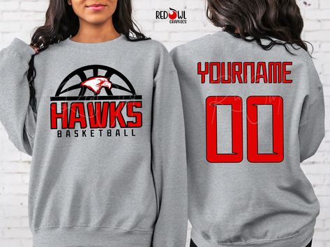 Personalized Hawks School Spirit T-Shirt Crewneck, Hoodie Hooded Sweatshirt Football, Baseball, Basketball, Softball, Track, Volleyball, Cross Country, Cheer, Wrestling Not all colors are available in all sizes and styles.  Please check the color and size charts in photos. We do our best to accurately represent shirt colors by using actual photos but do understand that all monitors will display differently. Please contact us prior to purchase with any questions on sizing or colors. Your purchase includes a custom imprint created specifically for your team! A product proof will be emailed to you within 1 business day.  Please keep an eye on your Etsy messages and reply with any changes within 24 hours. Your order will be sent to production after that time if no response is received. Excessi Eagles Basketball Shirt, Basketball Hoodies, Hornets Basketball, Represent Shirt, Basketball Cheers, Basketball Sweatshirts, Cricket Ideas, Cheer Shirts, Basketball T Shirt