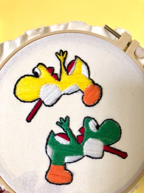 yoshi embroidery #yoshi #embroidery #yellowyoshi #greenyoshi #yoshiembroidery #embroideryhoop #satinstich #backstitch #yoshisisland #mariobros #yoshi Pikmin Embroidery, Yoshi Embroidery, Yarn Yoshi, Yoshi's Crafted World, Yoshi’s Crafted World, Sewing Embroidery Designs, Back Stitch, Embroidery Hoop, Embroidery Designs