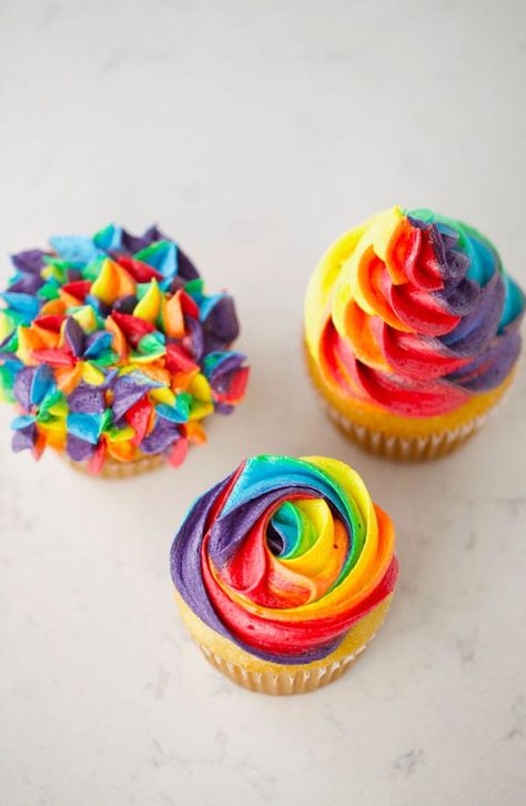 Easy Rainbow Buttercream Cupcakes - Mom Loves Baking Cupcakes Rainbow Decoration, Tye Dye Icing How To Make, Tye Dye Icing, Tie Dye Buttercream Frosting, Tye Dye Cupcakes Frosting, Tie Dye Icing Technique, Rainbow Icing Cupcakes, Rainbow Frosting Cupcakes, Tie Dye Cupcakes Frosting