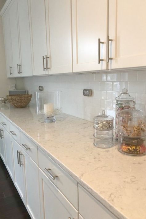 White kitchen with Viatera Minuet quartz countertops - Hello Lovely Studio. White Kitchen Cabinets With Beige Quartz, White Cabinets With White Quartz Counter, Short Quartz Backsplash, Kitchen Countertops With White Cabinets Quartz Carrara Marble, Quartz Counter Tops With White Cabinets, White Kitchen Counters Quartz, White Counter Tops With White Cabinets, Ventina Quartz Countertops, White Counter And Backsplash