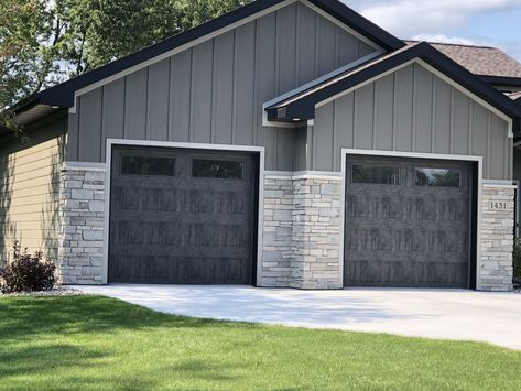 Barn Shop Ideas, Cabin Exterior Colors, Grey Garage Doors, Dark Grey Houses, Wood Pillars, Garage Door Colors, Dark Trim, House Makeovers, Exterior House Remodel