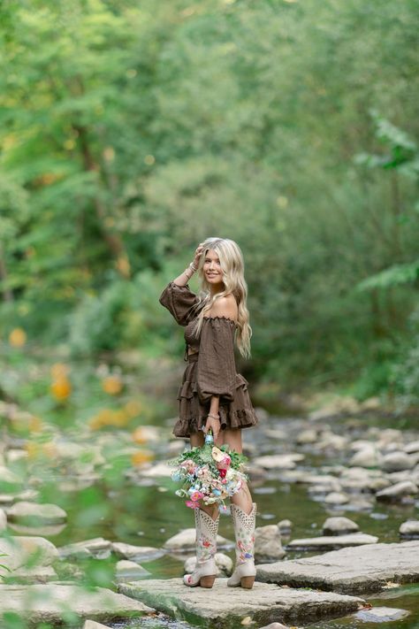 Wisconsin-based photographer photographs a western-themed seniors session with the senior taking photos on a creek in Appleton, while she's dressed in a cute flowy brown dress, with her cowgirl boots, and many other location ideas and inspiration for senior portraits.  #Westernseniorportraits #Appletonphotographer #Wisconsinseniors Western Style Senior Photos, Senior Picture With Mirror, Senior Picture Western Outfits, Fall Photoshoot Western, Cowgirl Boot Senior Pictures, Senior Picture Inspiration Fall, Poses For Sweet 16 Picture Ideas, Fall Senior Picture Ideas Outfits Country, Senior Photos In Creek