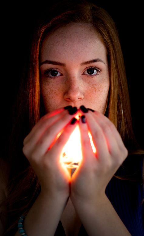 Woman Holding Lighted Candle in Front of Her Face ¡¤ Free Stock Photo, #Lighted, #Candle, #Front, #Holding, #Woman Woman Looking Down At Her Hands, Person Holding Orb Reference, Holding Apple Pose Reference, Hands In Front Of Body Reference, Holding Orb Reference, Hand In Front Of Face Pose, Hand Holding Face Reference, Hands In Front Of Face, Poses Holding Something