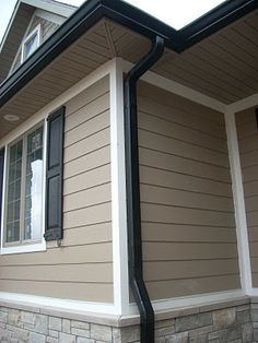 Black Gutters. windows are white vinyl with black trim and exterior is blue/grey.. I think its gonna look gooood Black Gutters, Roof Soffits, Retirement Goals, Tan House, Fasad Design, Shop Exterior, House Upgrades, Roof Ideas, Black Shutters